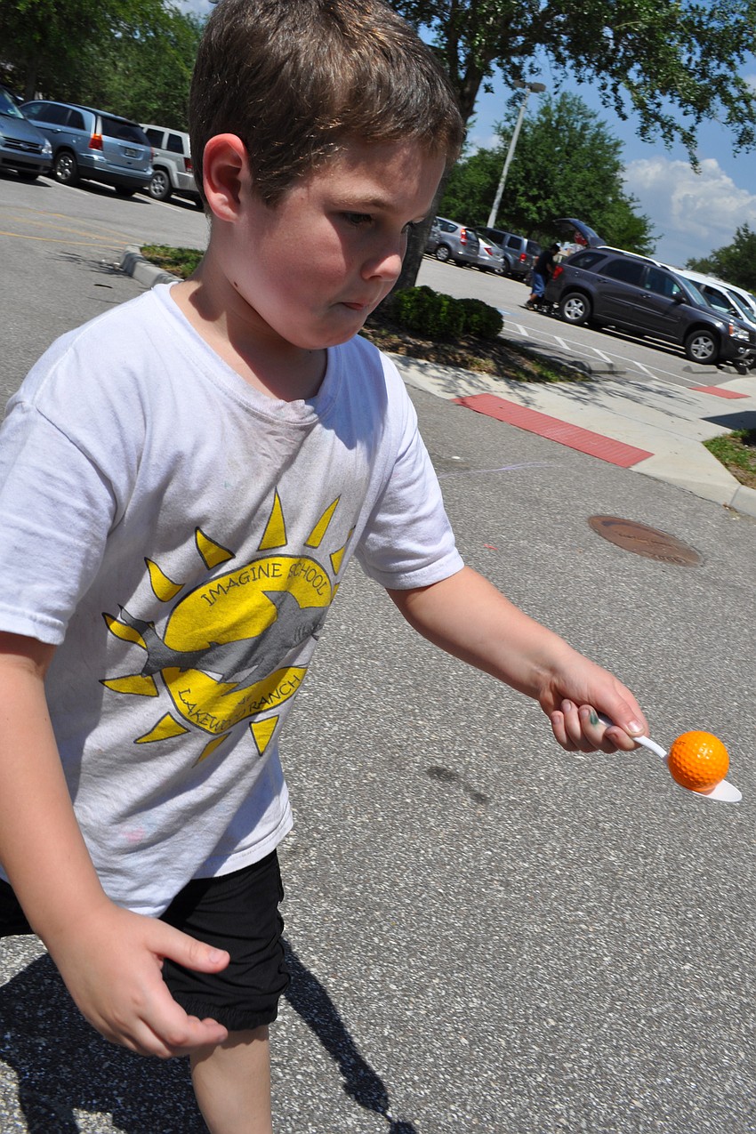 Drew Carpenter, 7, kept his hand steady.