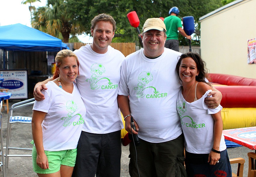 Jessica Moore, Ryan Schmidt, James Ridout and Brandi Tufenkjian pose together in their matching shirts, Saturday, April 14, during the Siesta Gladiator Charity Challenge.