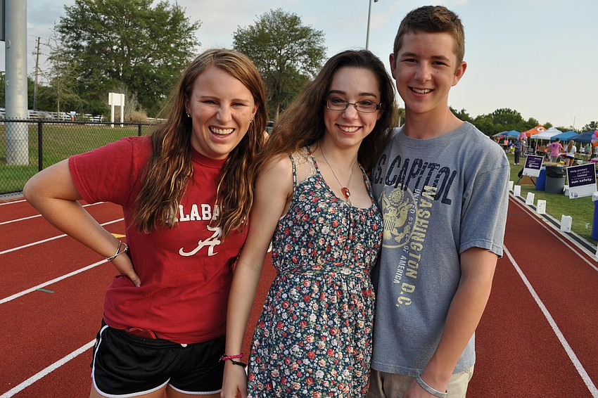 Abby Harriman, Stephanie Muench and Chris Glaser walked began their walking almost immediately.