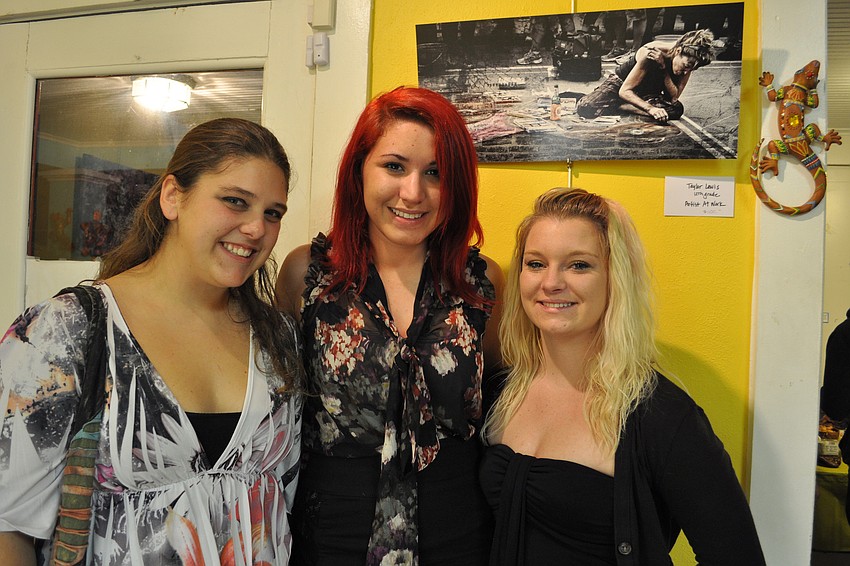 Jackie Ell, left, and Jordan Bailey, right, came out to support their friend, artist Taylor Lewis, center.