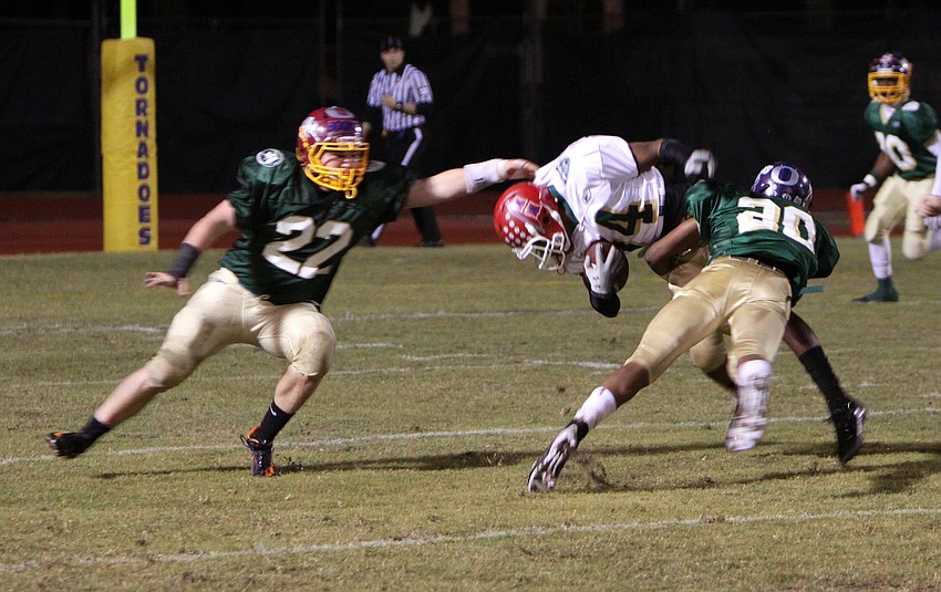 Lecio DePaula, 27, and Ezra Robinson, 20, teamed up to take down Antonio Agurs, 34, during the 20th Annual Brad Price Memorial PAL Bowl.