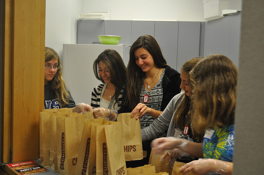 Samantha Chianese, Sofia Bever, Demi Giannopulos, Chloe Thacker and Sabrina Chianese help prepare snacks.