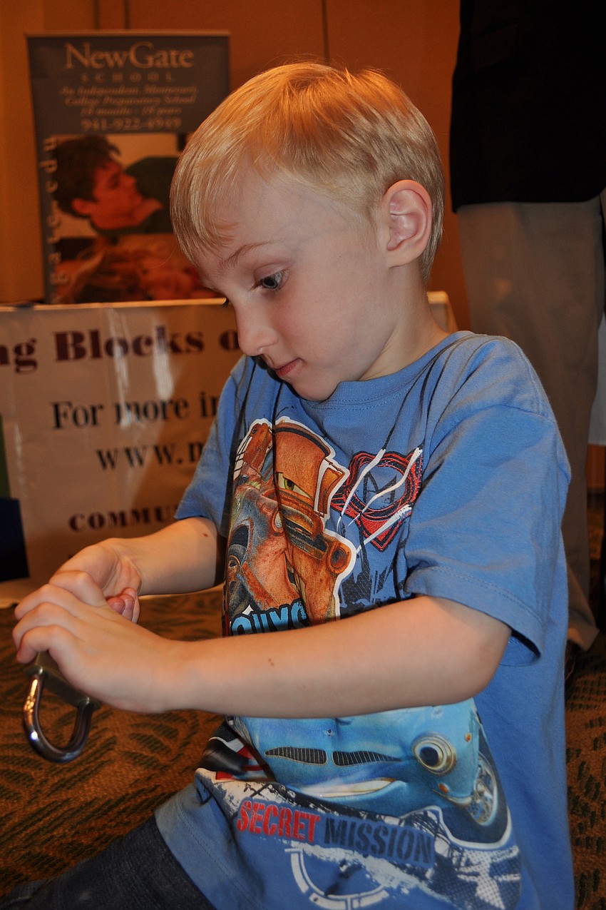 Reese Swanson, 5, tried out the lock lesson offered by New Gate School.