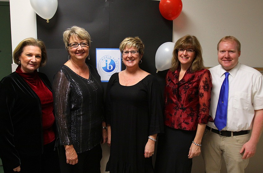 Fifth grade teachers Ann Matthews, Marti Illig, Kerry Scarpinato, Lisa Edwing and Eric Eckberg pose together in the hallway, Thursday, Jan. 12, during the 5th grade Documentary Film Fest at Phillippi Shore Elementary.