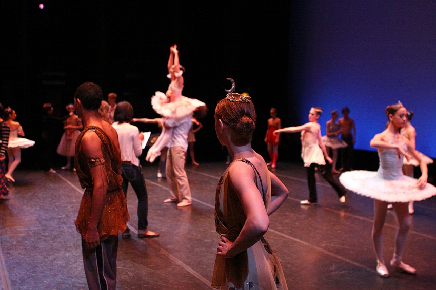 Yamil Maldonado and Kayleigh Likens look around the stage at the other students warming up for the pas de deux portion of the competition.