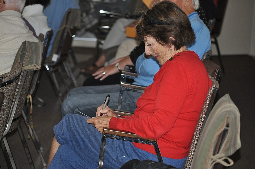 Gloria Wertzman writes down an answer Kenard Chandler will guess