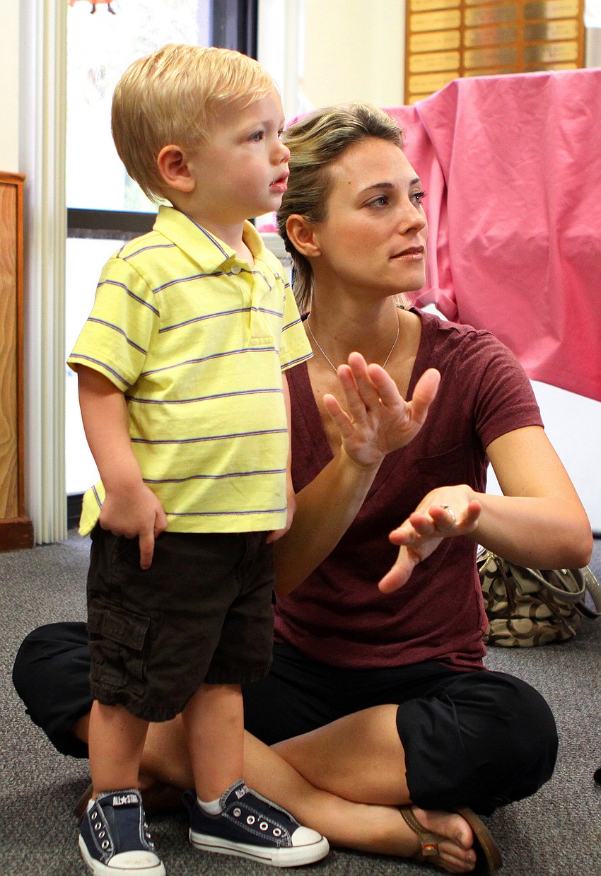 Carrie Murse and her son Colton, 23 mos., learn the sign for â€œsongâ€.
