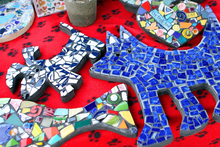 Kylie and Friends Pet Creations had some of their mosaics made by students from Oak Park North on display Friday night during the Smooches for Pooches and Kisses for Kitties event.