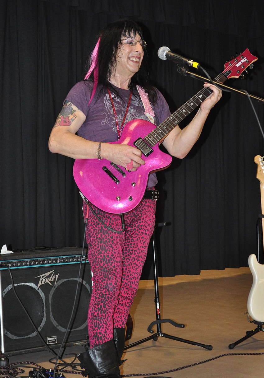 The Guitar Centerâ€™s Jimi Gee entertained students on the guitar.