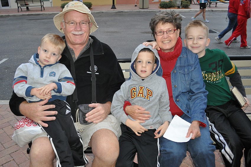 Bryan, Logan and Connor Catlett, pictured with their grandparents, William and Maryellen Carr, came to watch their parents and brother run.