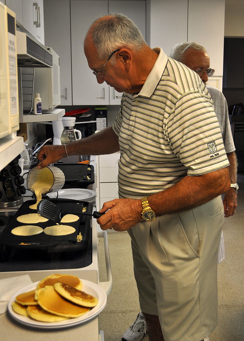 Dale Lattanzio makes some pancakes on the griddle.
