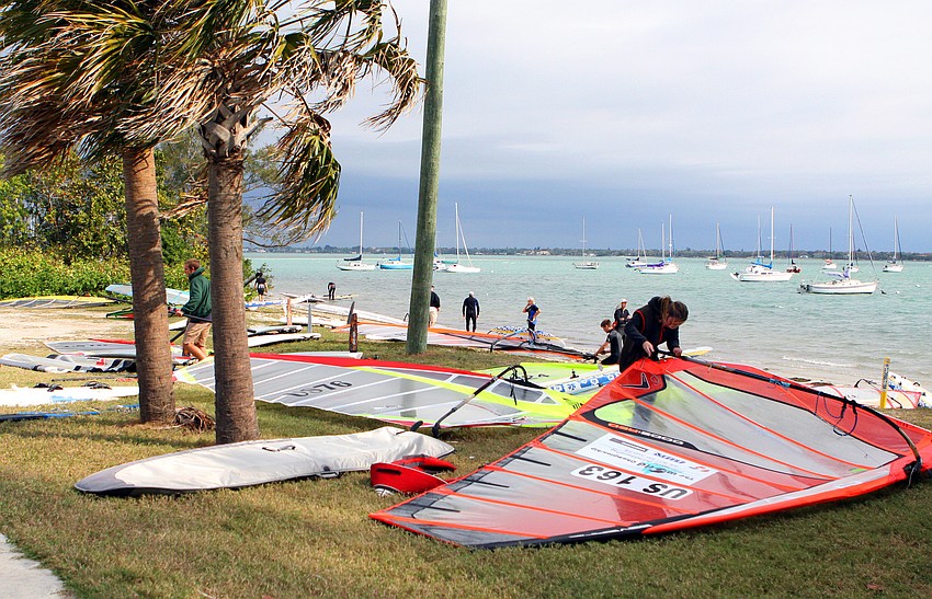 Windsurfers get themselves ready to head out on the water, Sunday, Feb. 26 for the Windsurfing competition held Saturday and Sunday out at Sarasota Sailing Squadron.