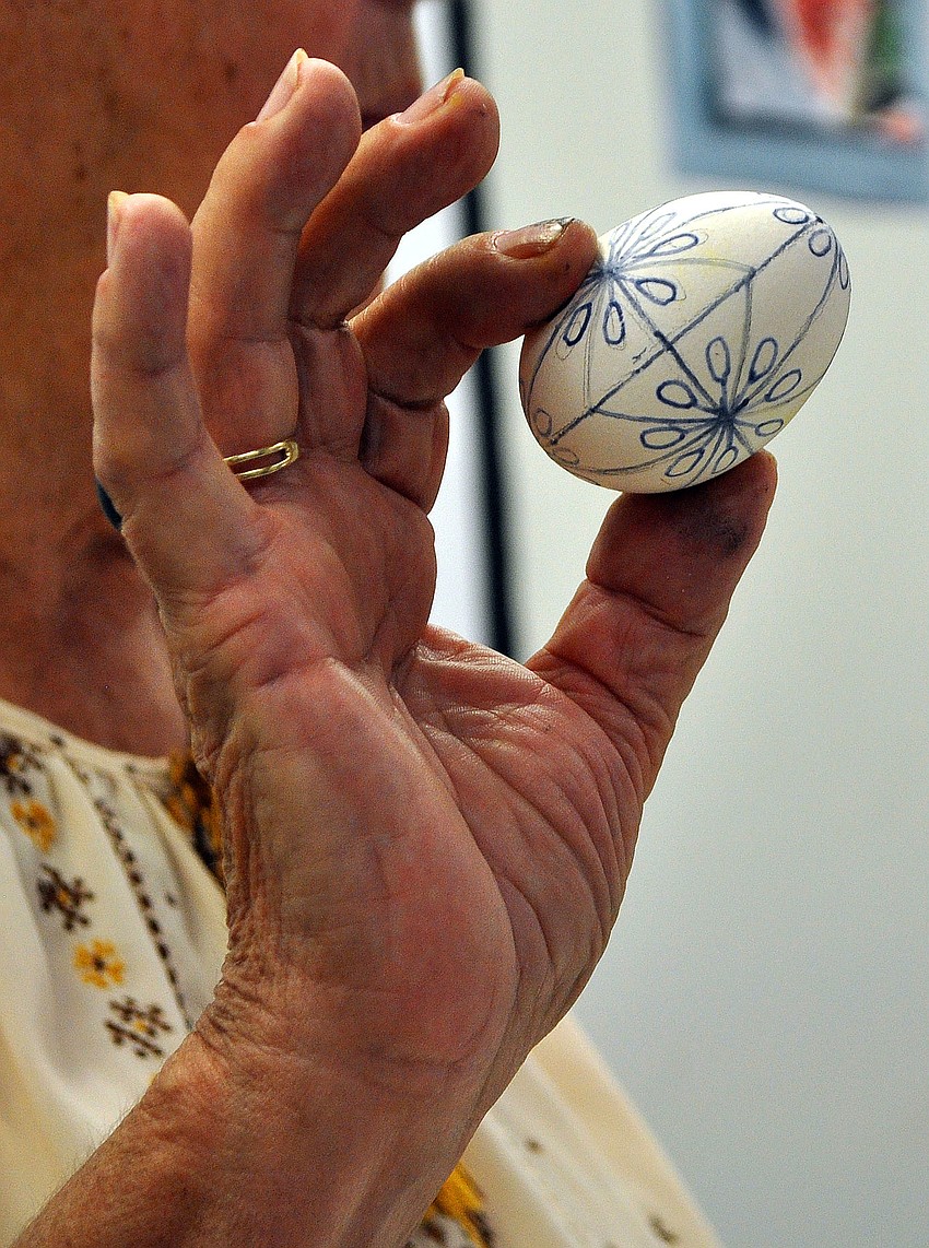Tetiana Silecky shows off one of the designs for a Ukrainian Pysanka, 