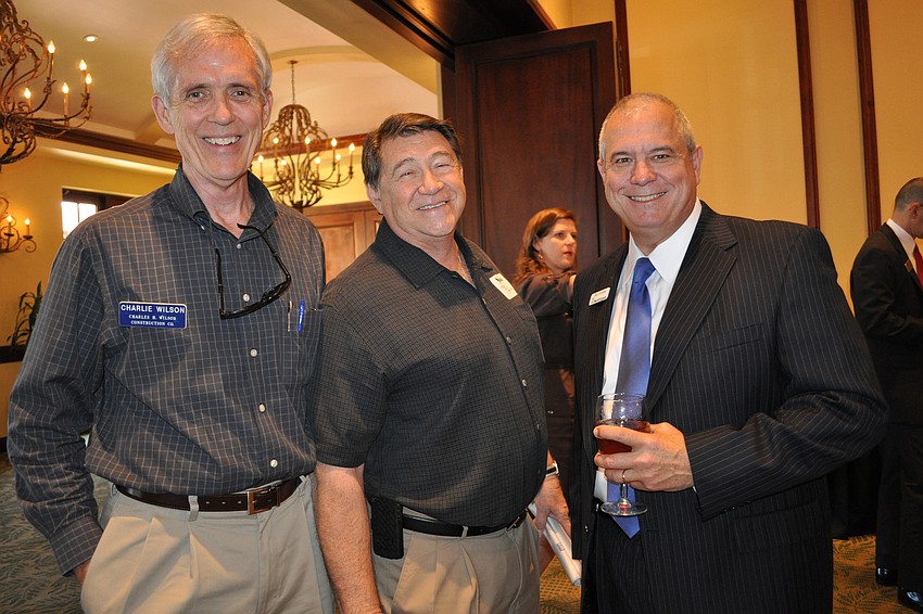 Charlie Wilson, of Charles H. Wilson Construction, with Kelly Rubino, of Hanson Professional Services, and Dan Forbes, of Merrill Lynch