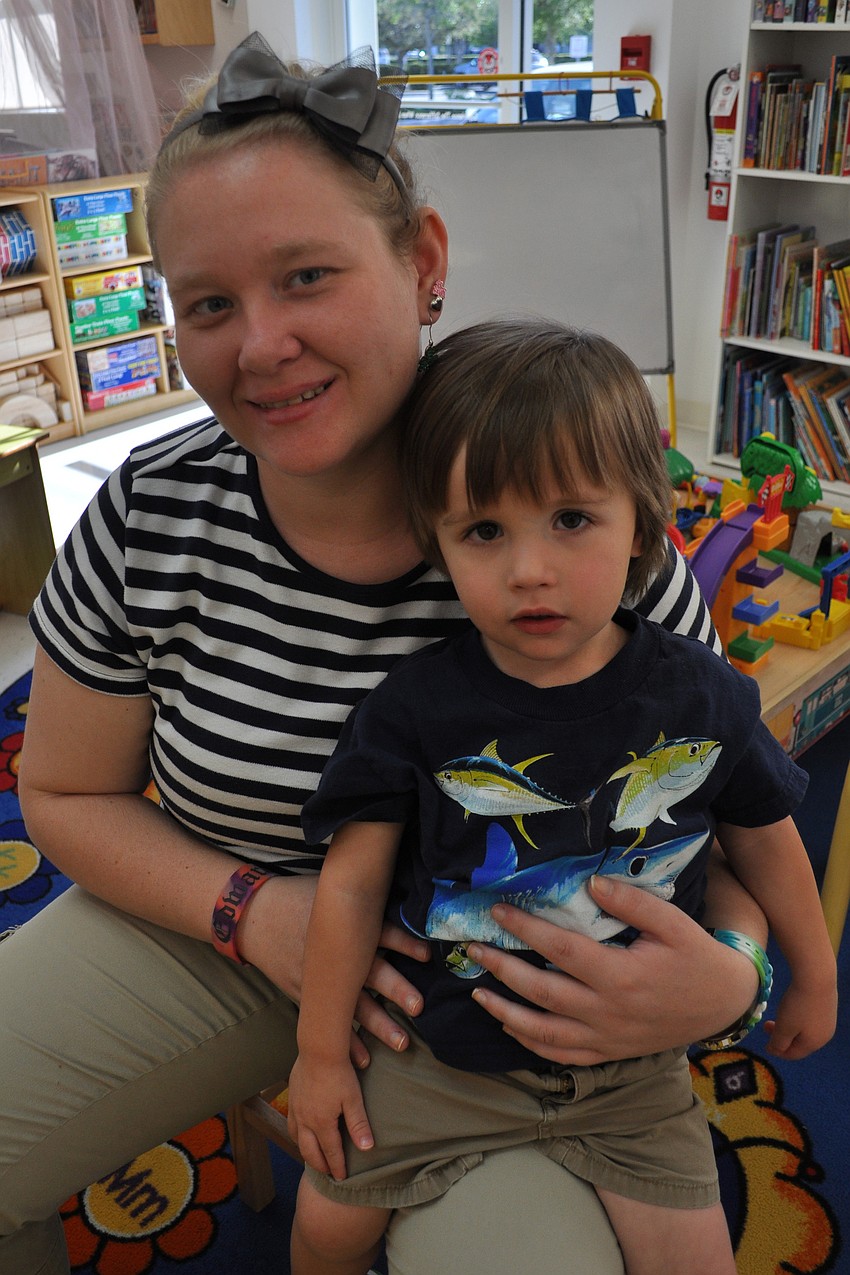 Brennon Bonnett watched the presentation from the lap of Christina Nuccio.