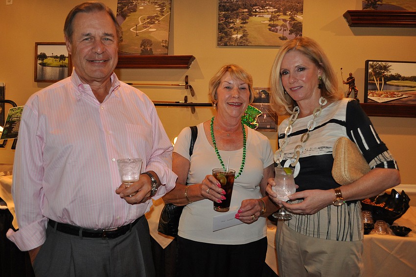 Dawn Sutton, center, brought her friends Bruce and Sandy Hammonds as guests.