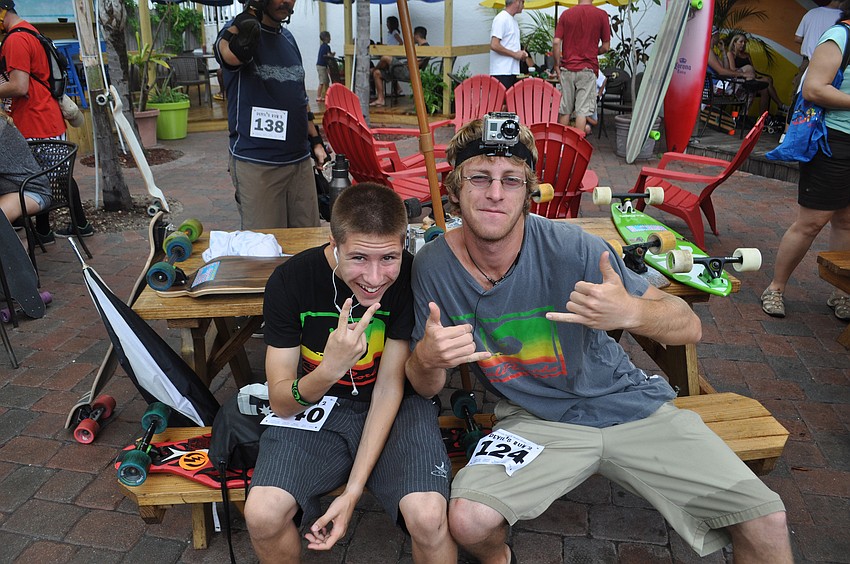Christian Gidus and James Alessandrelli wait for the rain to die out.