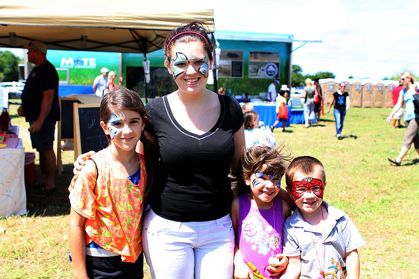 Ariana Aristimuno, 10, Meaghan Booker, 16, Mackenzie Gurocisio, 5, and Joey Gurocisio, 4, had their faces painted at Springfest.