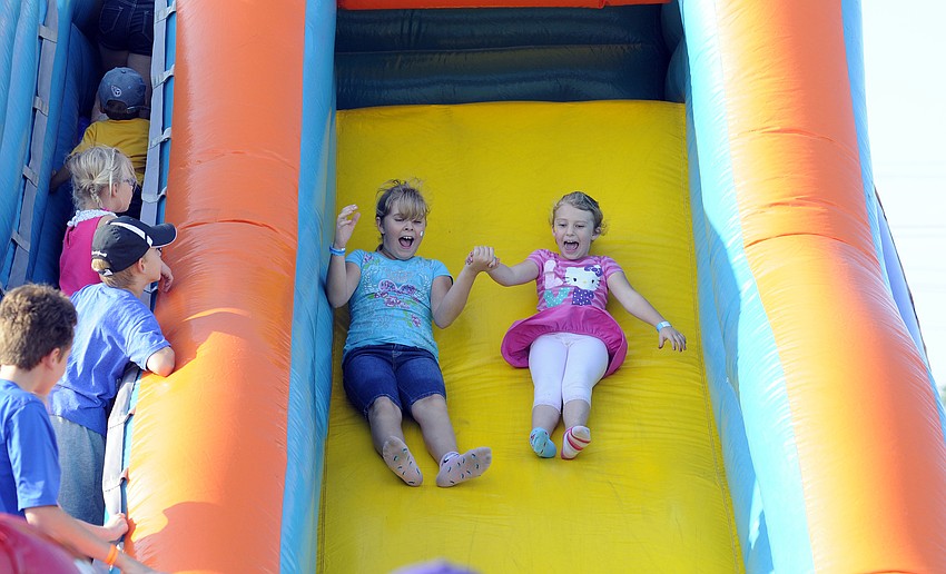 Nine-year-old Sasha Krill made several trips down the slide with her good friend Mikayla Kelly, 7.