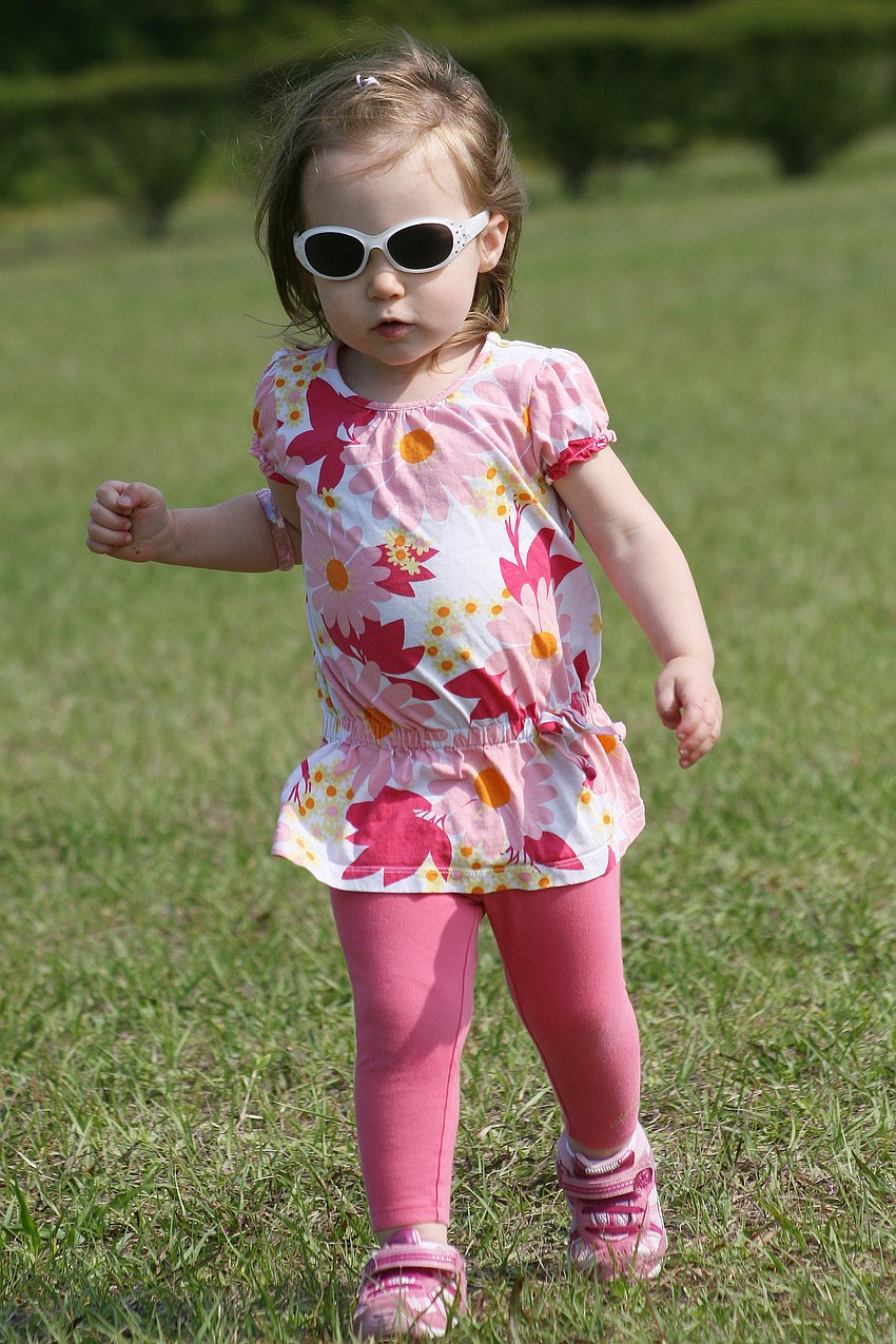 Noelle Stead, 2, searched hard for specific eggs at Harvest United Methodist Church.