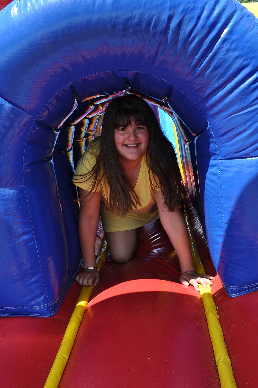 Alexa Affolter made sure to try out the inflatable obstacle course.