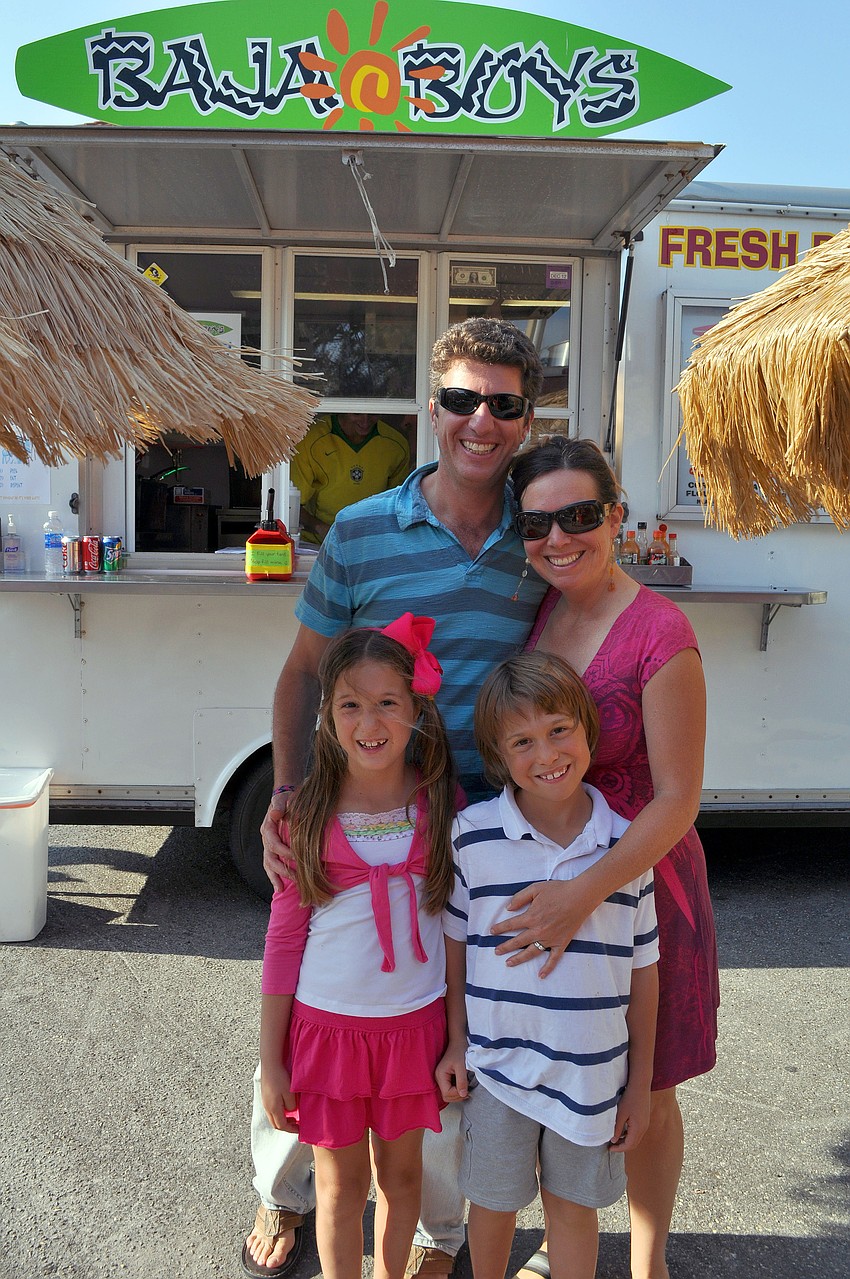 Lee and Lisa Mirman with their daughter, Ella, 8, and son, Gabriel, 7, get ready to enjoy some food from Baja Boys, Friday, April 13, during Ringling Picnicâ€™s Spring Fling.
