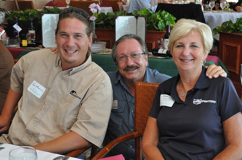 Tom Manson with Manson Roofing, Joe Landolfi with Manson Roofing and Sandee Davis with Grimefighters