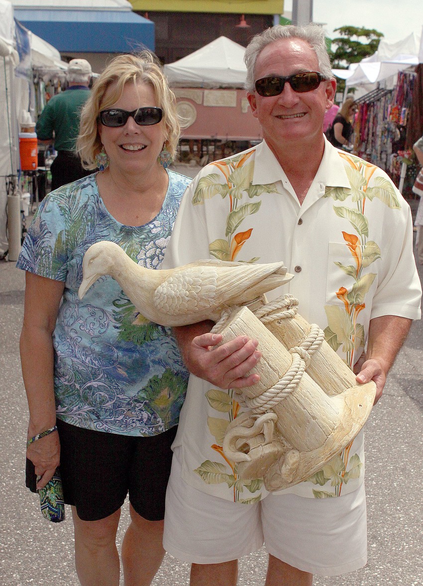 Nancy Deeb and Rich Henry with their new seagull statue.