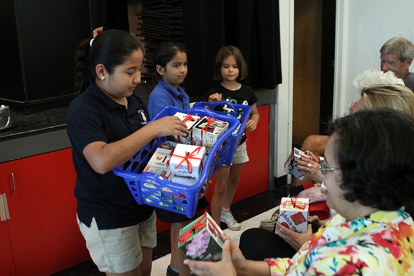 Some of the girls helped to hand out special banks to the volunteers.