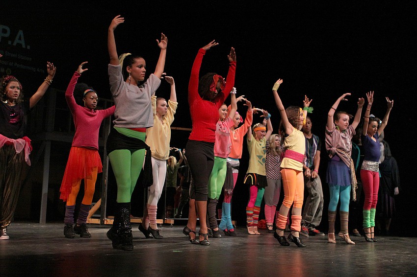 The dance students practice their routine during a scene in Fame, Jr., Saturday, April 22, at Booker High Schoolâ€™s auditorium.