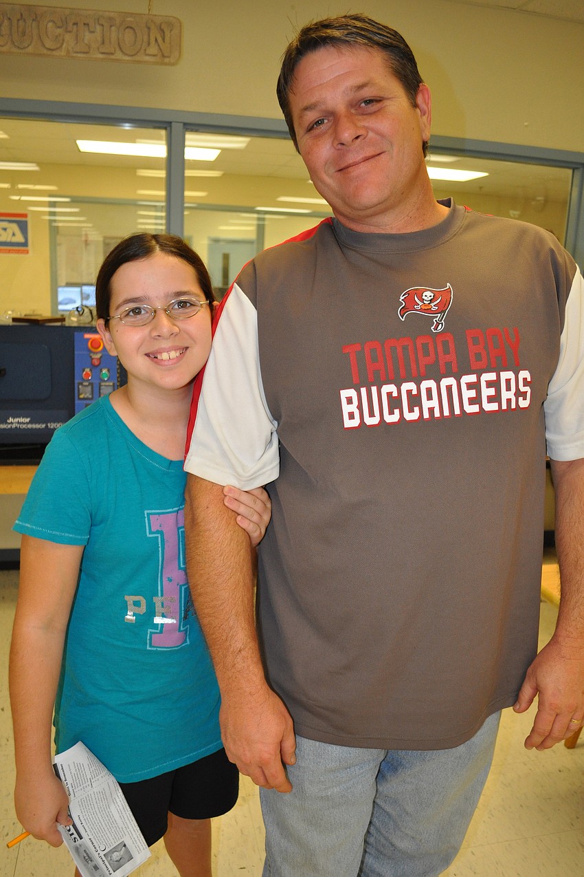 Haile Middle School student Destiny Summerville came out with her dad, Chad, and her brother, Devon, who will start school at Haile next school year.