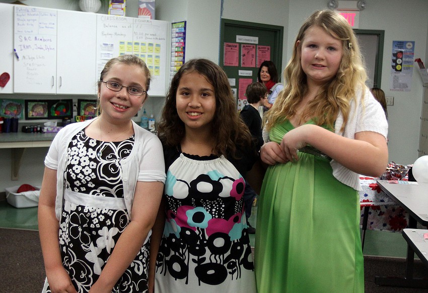 Raegan Nolten, 10, Mackenzie Manankil, 12, and Julie Price, 11, all dressed up for the premier night of their 5th grade documentaries, Thursday, Jan. 12, at Phillippi Shore Elementary.