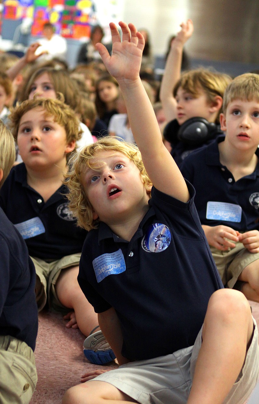 Tanner Luria, 6, raises his hand to ask Dan Strzempka a question, Friday, Jan. 20, at Out-of-Door Academy.