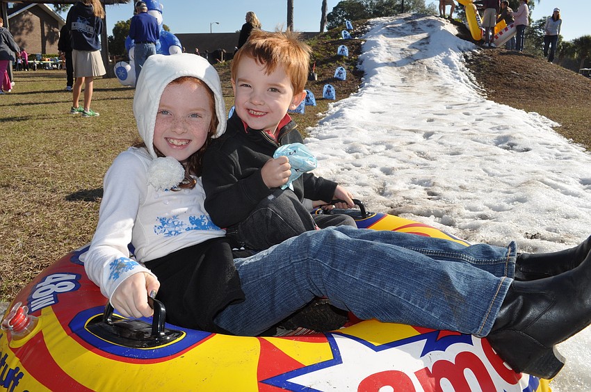 Cael Roby, right, rode down the slide with his sister, Zoee.