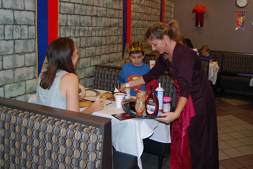 Shanna Watkins gave Icedream toppings to Anthony Longo and his mom, Valerie.