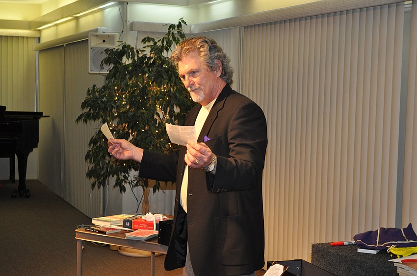 Chandler rips a page from a book in half