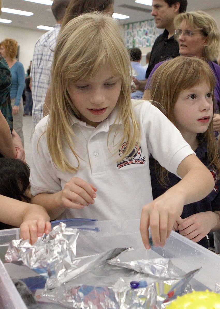 Heather Garcia, 9, was able to put 204 marbles on her 