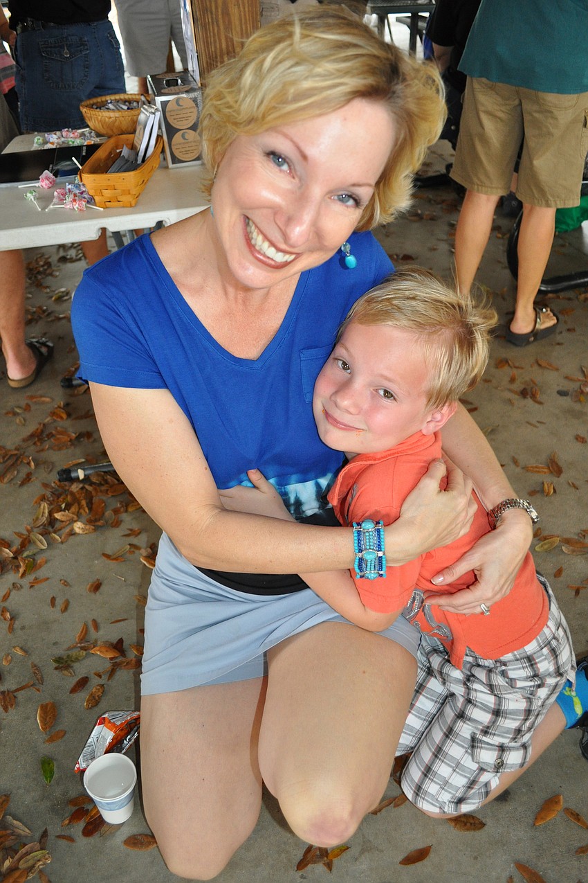 Rebecca Zimmerman, with her son Tommy, made sure to meet other guests.