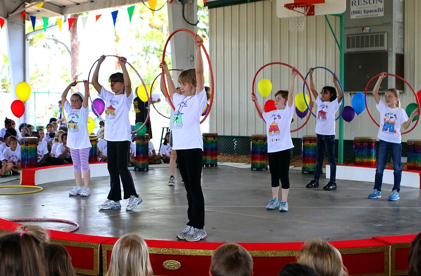 During the fourth grade circus some of the kids performed with hula hoops.