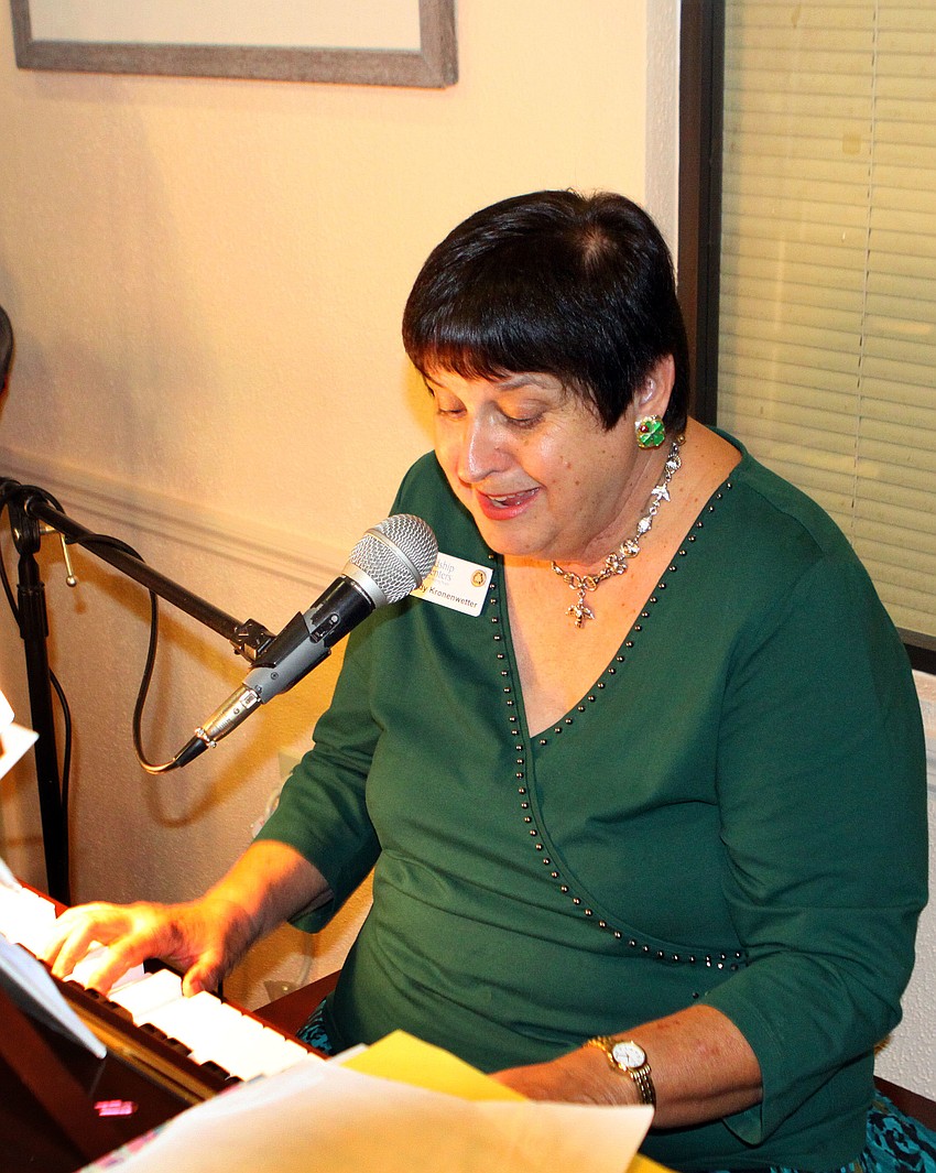 Judy Kronenwetter played the piano and led the crowd in singing traditional Irish songs during Elizabeth Delaney's 109th birthday party, Monday, March 12, at the Senior Friendship Center.