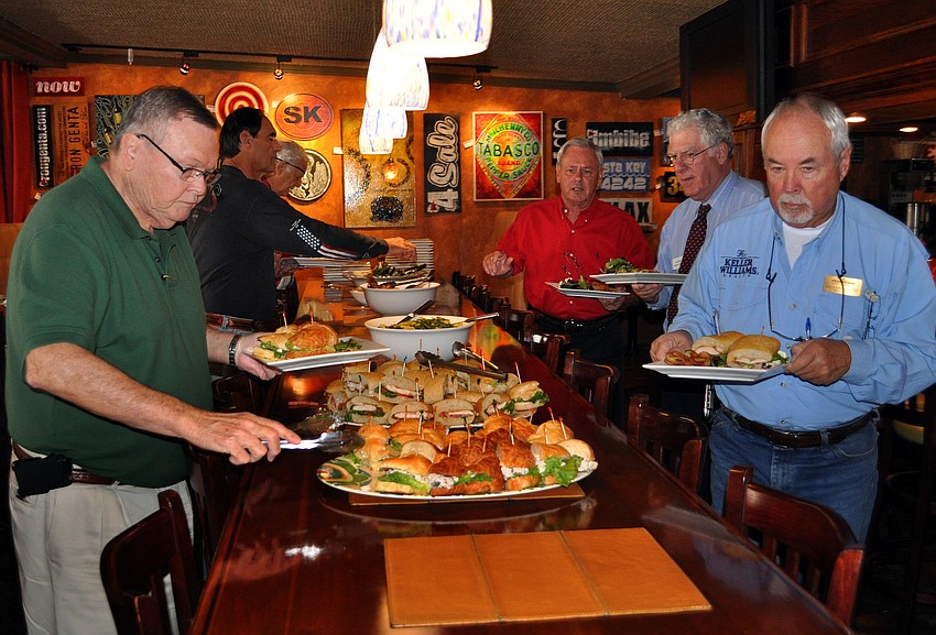 Members of YES fill up their plates for lunch.