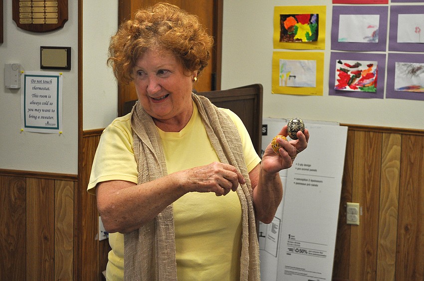 Orysia Zinycz shows off some of the extra Pysankas that she and Tetiana Silecky brought along, Tuesday, March 13, to the Gulf Gate Library.
