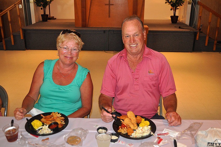 Nancy Lumb and Jerry Caisse enjoy their dinner, Friday, March 23, at St. Michael the Archangel.