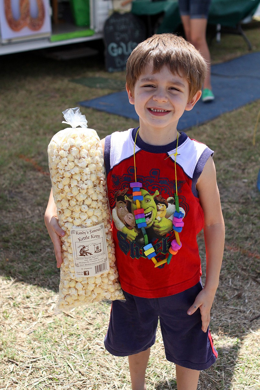 John Luke Bizzaro, 5, was very excited to get a bag of kettle corn.