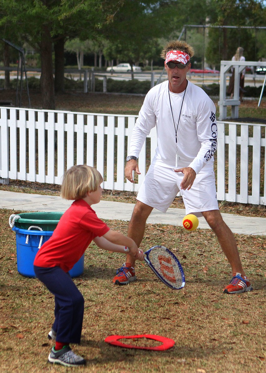 Dawson Clark, 6, gets ready to hit the ball as Coach Dave Villani looks on, Tuesday, March 20.