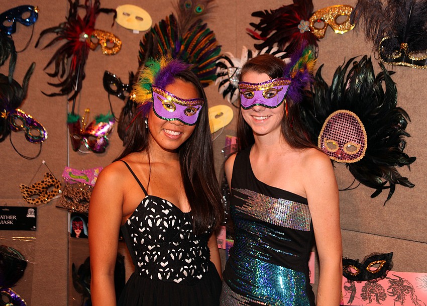 Jennifer Dong and Kendall Chlebina, members of Pine Viewâ€™s Key Club, helped to sell masks, Saturday, March 31, at The Might Masquerade at Michaelâ€™s on East.