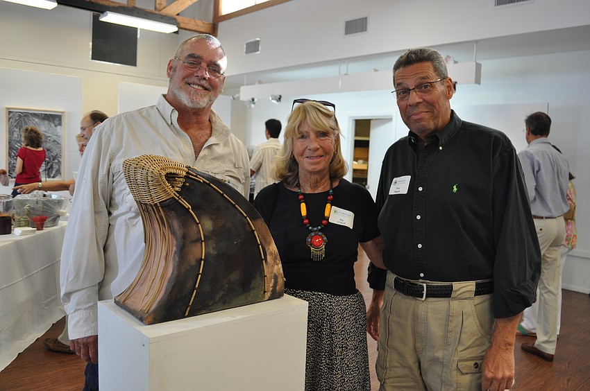 Tom Mayers, Kip Oâ€™Neill and Terry Petesch in front of Sandy Frickâ€™s work Rana Bamboo