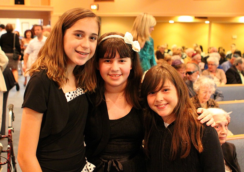 Eliza Lipton, Emma Diner and Rebekah Steinbach all sang in the Children's Choir for the remembrance service.