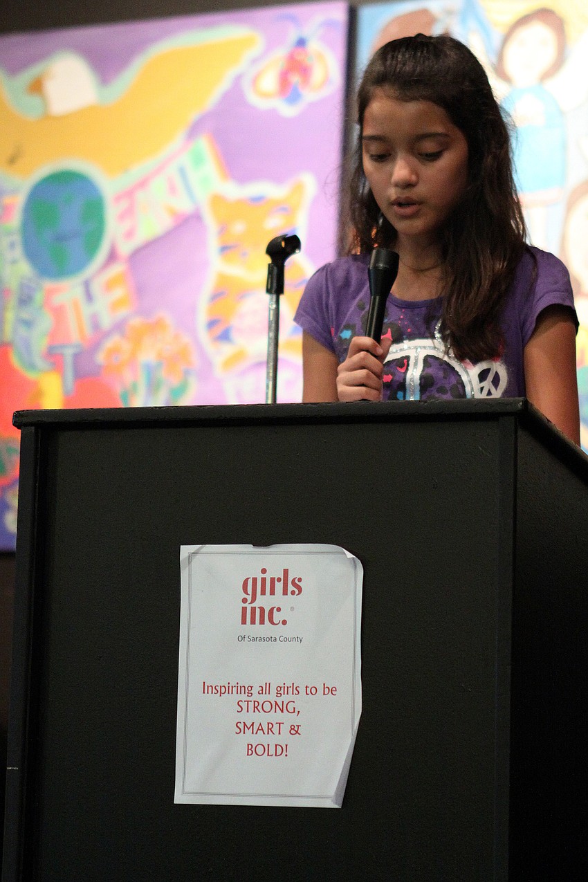 Allison Zavala, 11, speaks to the crowd, Thursday, April 19, during the Girls Inc Volunteer Appreciation Day ceremony.