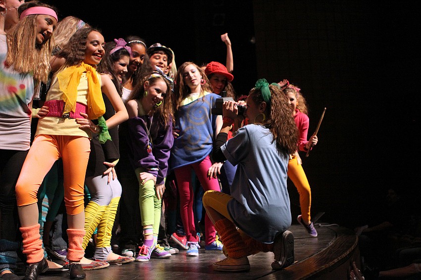 Taylor DeStasio, 7th grade, takes a Polaroid of the class at P.A.